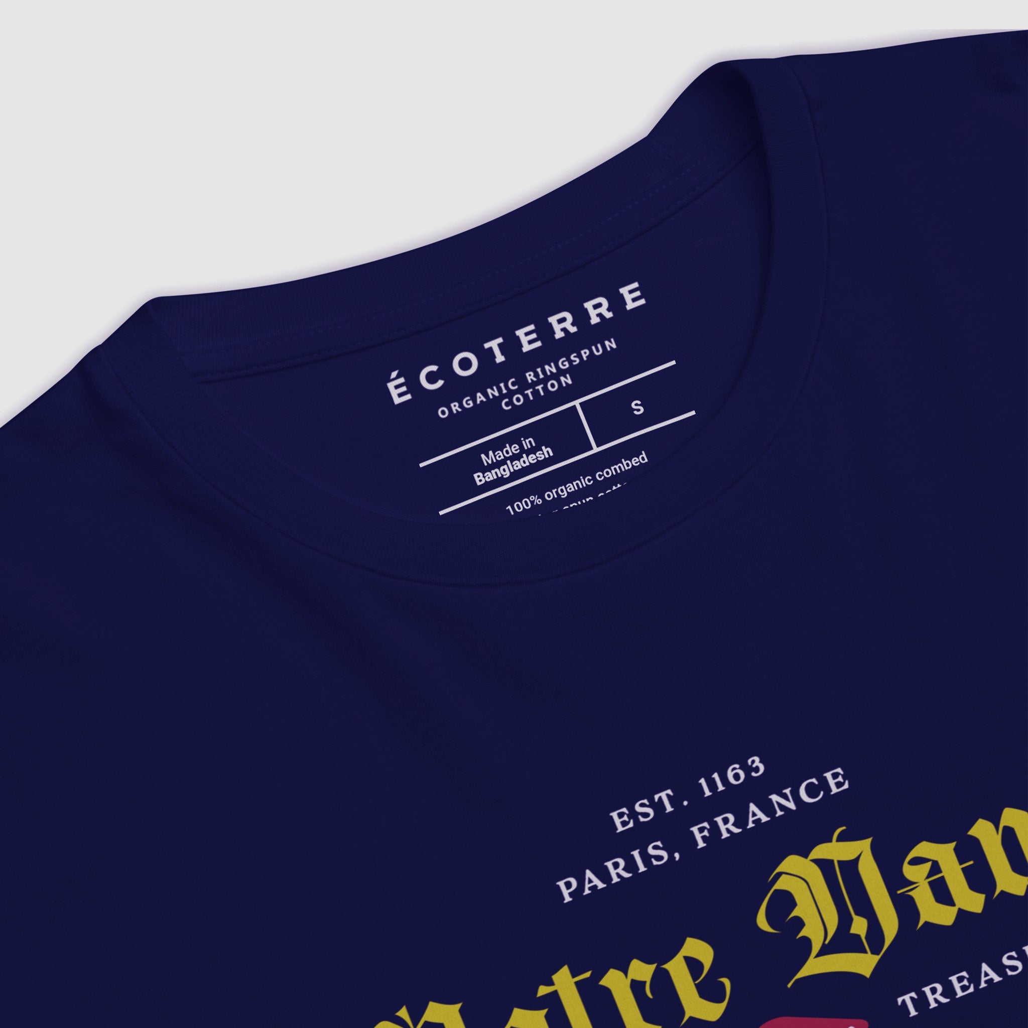 Notre Dame classic white kid/youth eco tee by EcoTerre. The colors are yellow, white and red over a navy eco-friendly t-shirt. The design features a close up at an angle featuring a Gothic font in a collegiate design aesthetic.